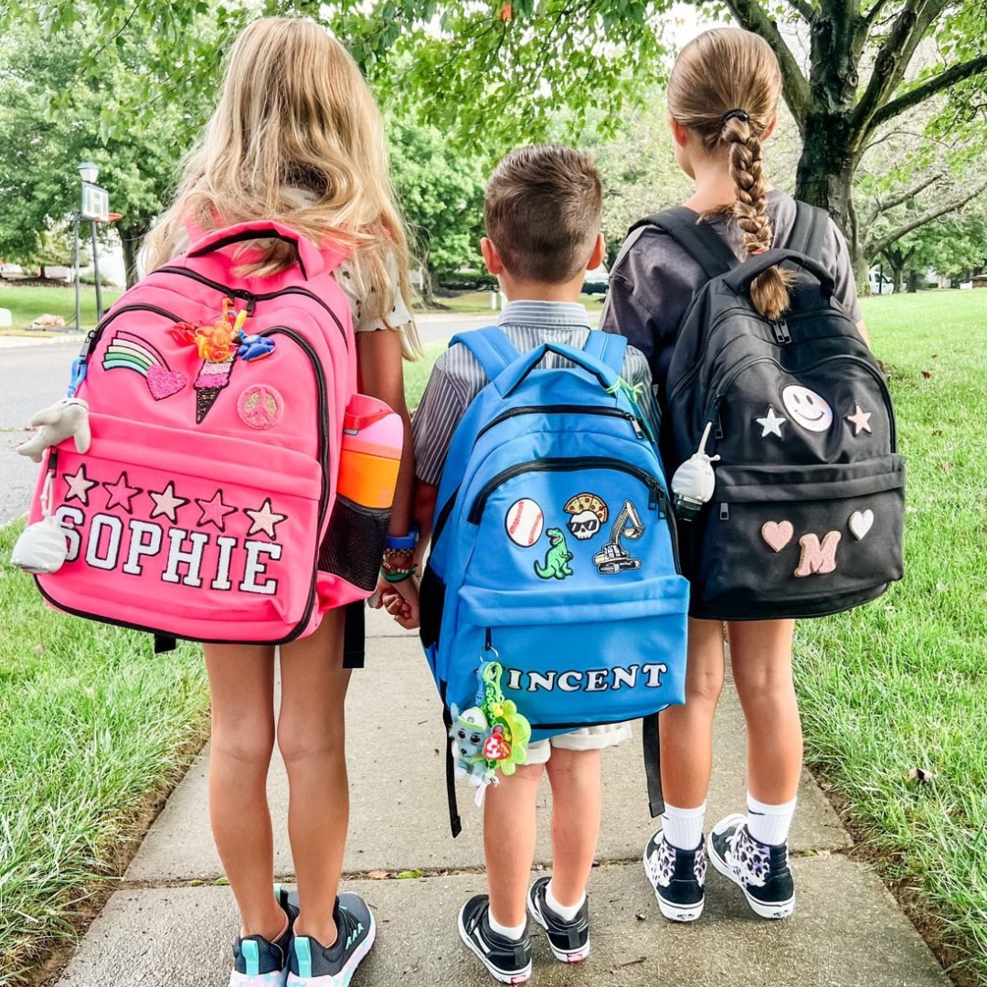 Children wearing Neon Elephant backpacks