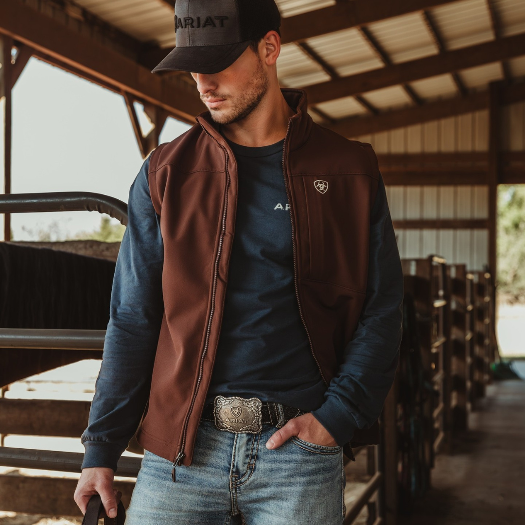 Buckle man wearing vest and jeans