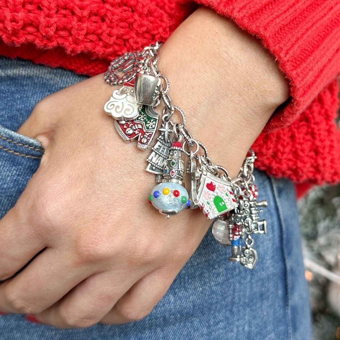 James Avery A girls hand wearing a charm bracelet from James Avery
